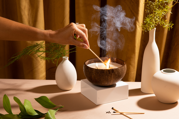 Sustainable soy wax candle styled with home decor accessories