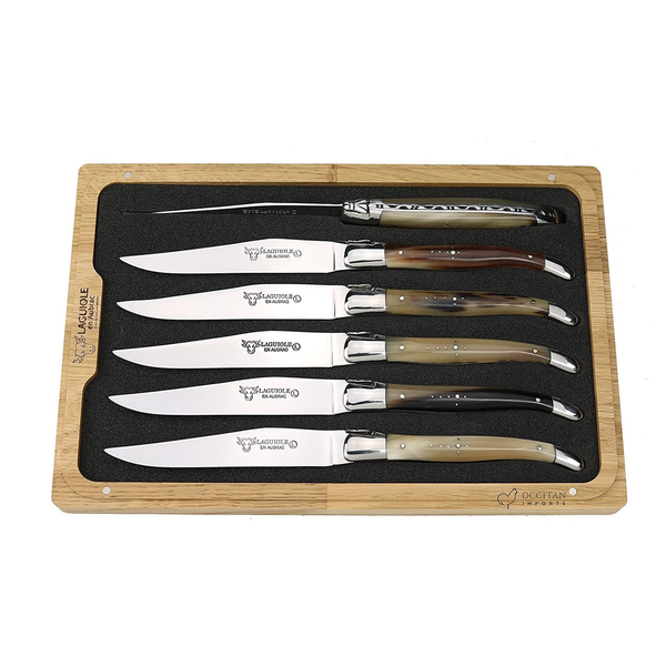 Six Laguiole en Aubrac steak knives with naturally varied solid horn handles and polished steel blades in a fitted wooden presentation box