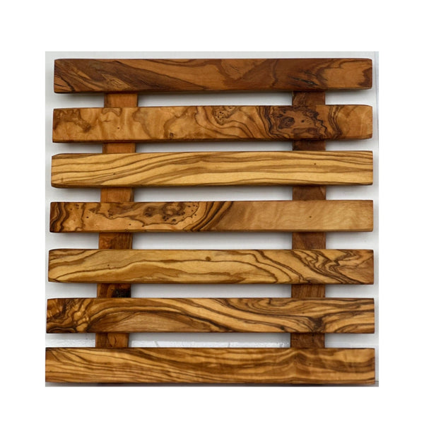 Close up detail of olive wood grain and natural edge trivet