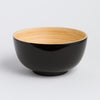 Large Black and beige bowl on a light gray background