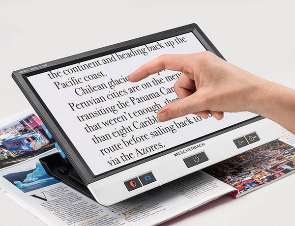 Eschenbach Visolux Digital XL FHD magnifier on its built-in stand
